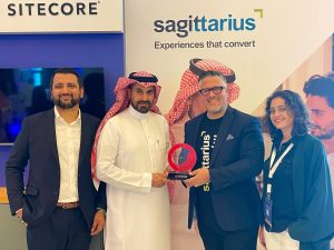 Image of Sagittarius's CEO, Ian, receiving an Award for Partnering Excellence at E3 CX Conference in Riyadh