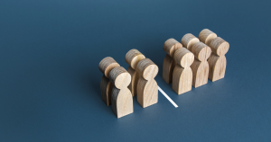 image of 10 wooden figures separated by a white line. 4 figures one side of the line and 6 figures on the other side of the line. This is to depict Multivariate testing